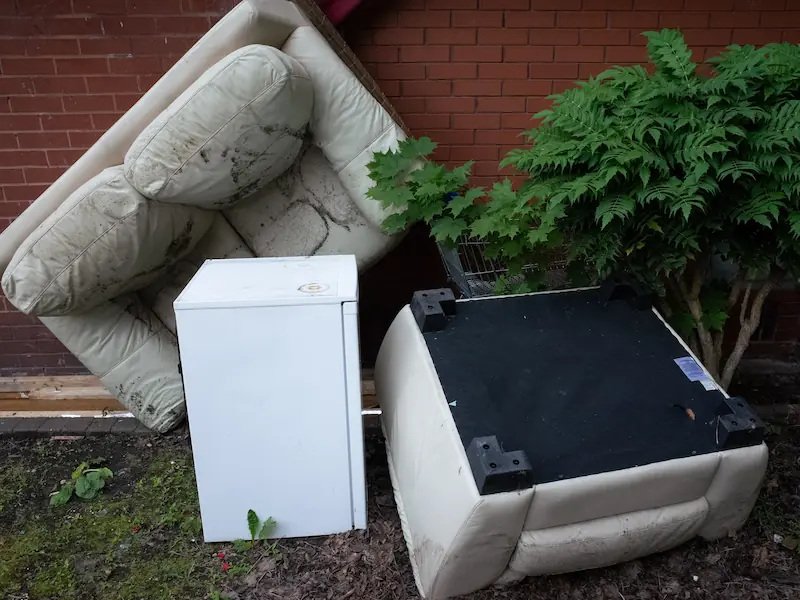 A big sofa leave upside down in street