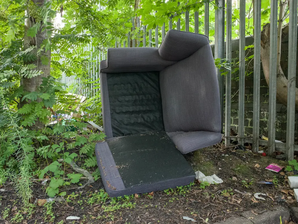 A big sofa leave upside down in street