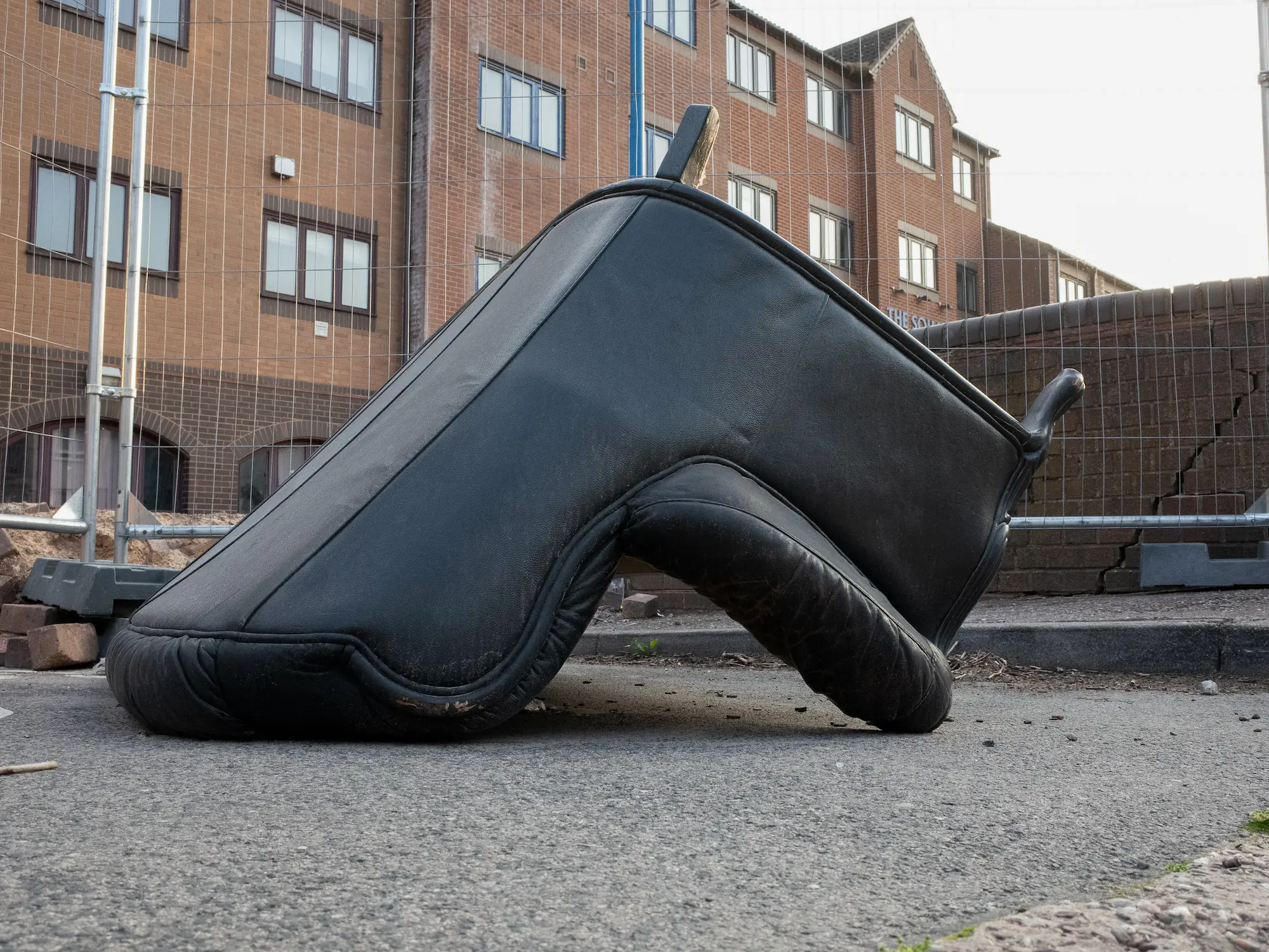 A big sofa leave upside down in street