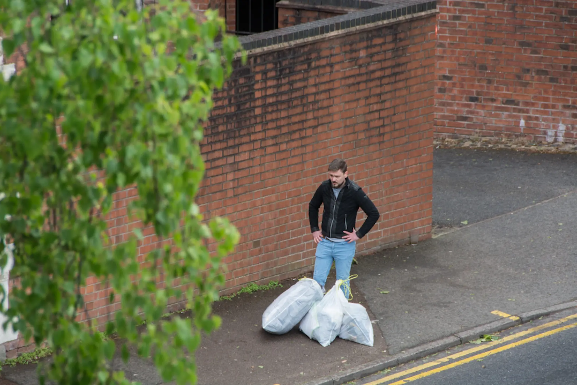 A shopping trolly is falling in the canal