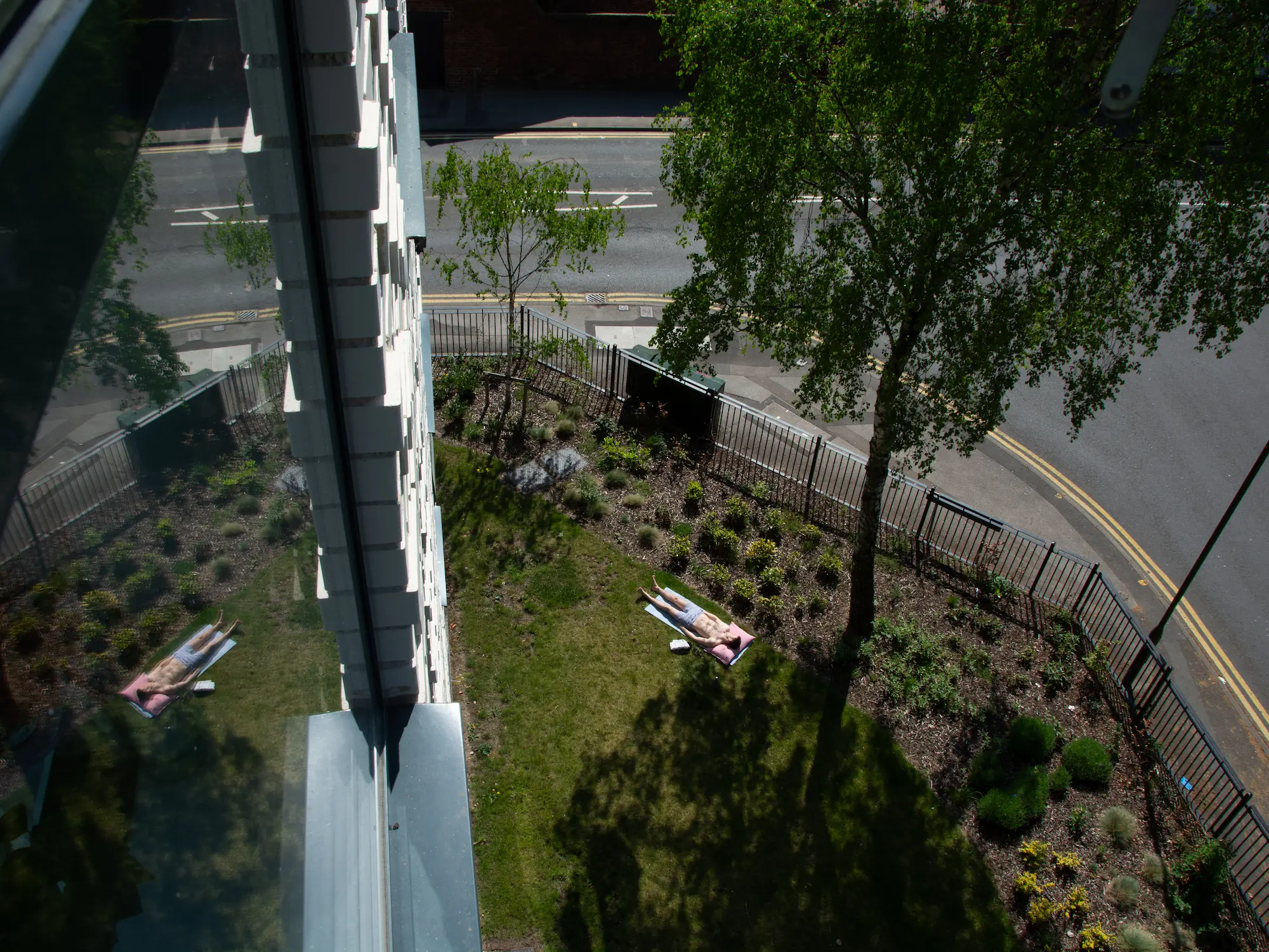 A shopping trolly is falling in the canal