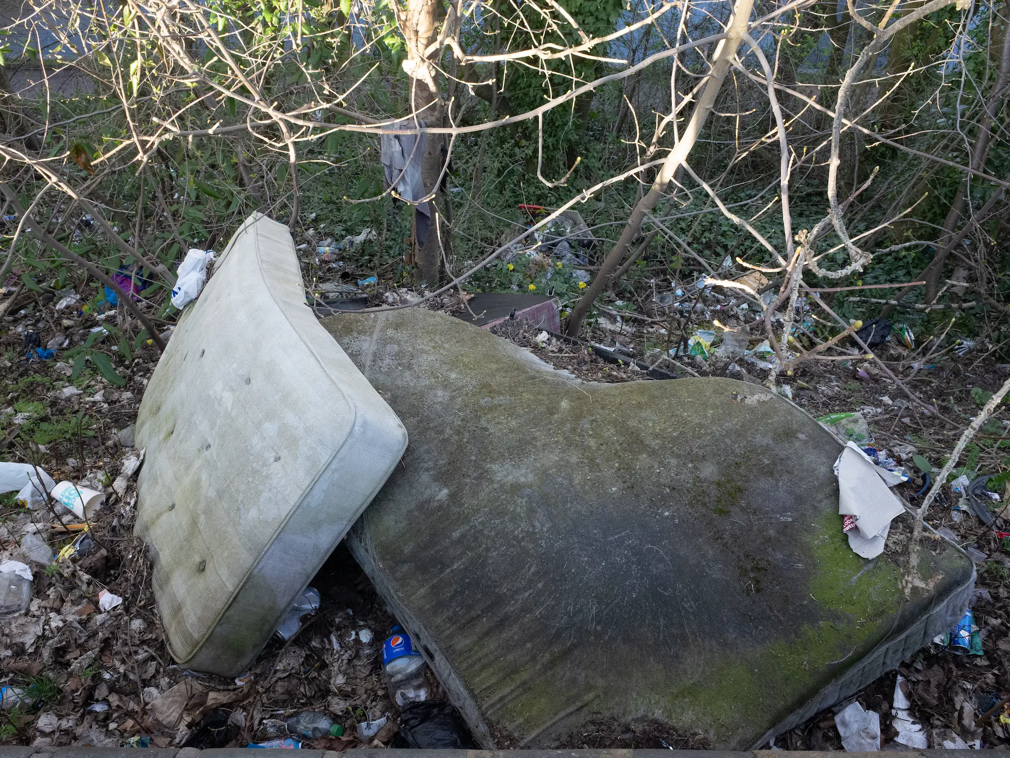 A shopping trolly is falling in the canal