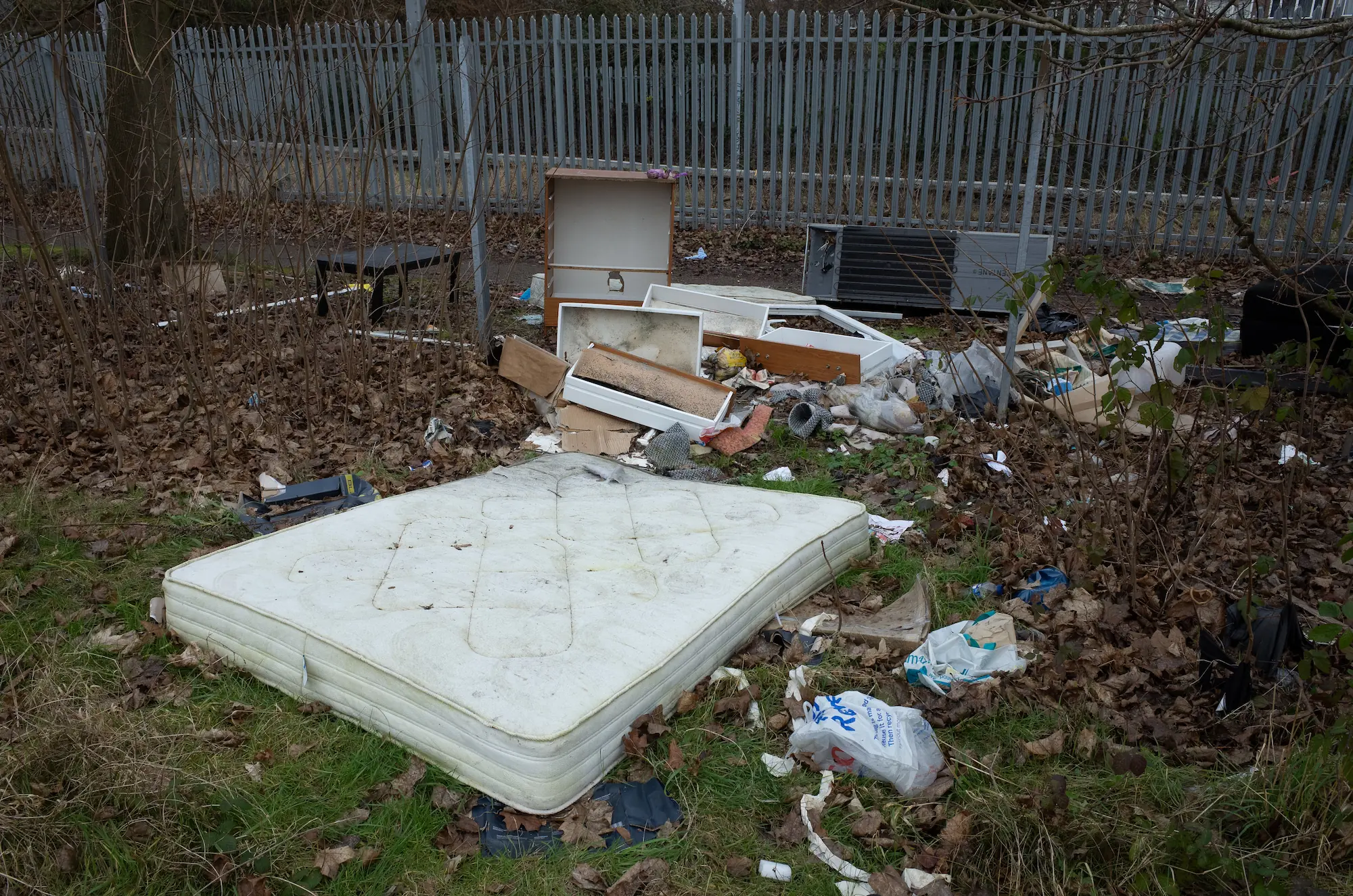 A shopping trolly is falling in the canal