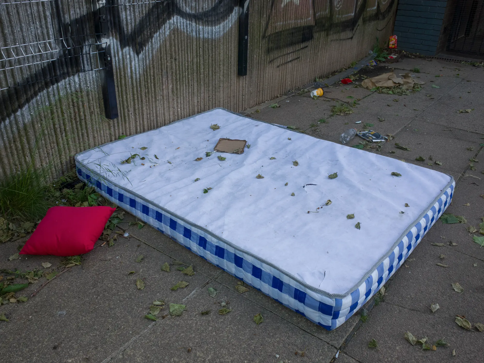 A shopping trolly is falling in the canal